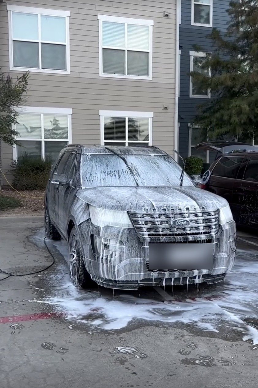 Foam pre-wash on an SUV, done on-site in Houston